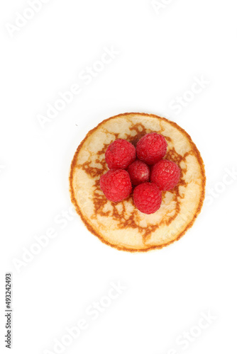 Pancakes with red fruits  blueberries  raspberries and blackberries on a white background 