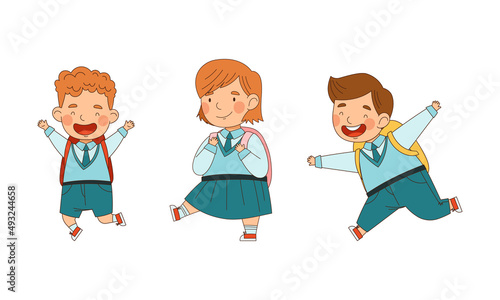 Cute schoolkids in blue uniform going to school set. Happy elementary school students with backpacks cartoon vector illustration