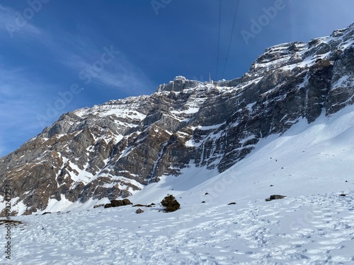 Idyllic steep alpine rocky peaks of the Swiss Alpstein massif dressed in icy pure white snow cover - Canton of Appenzell Ausserrhoden, Switzerland (Schweiz)