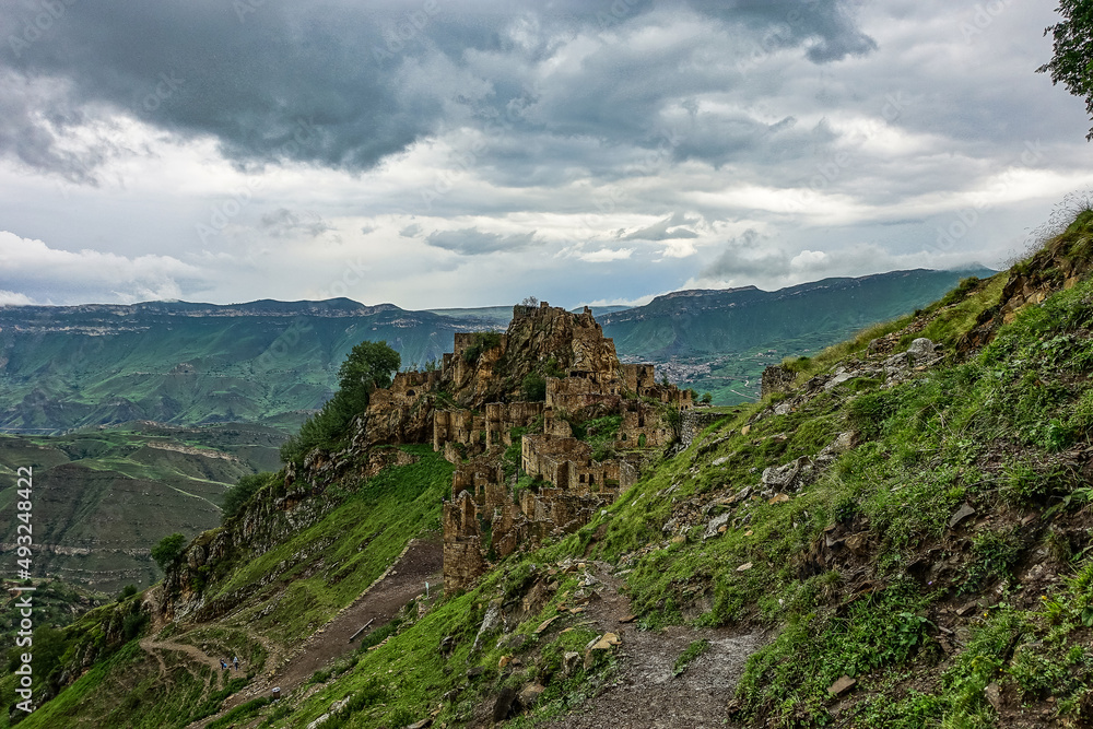 Gamsutl village in the Caucasus mountains. Old stone buildings on top of a cliff. Dagestan Russia June 2021