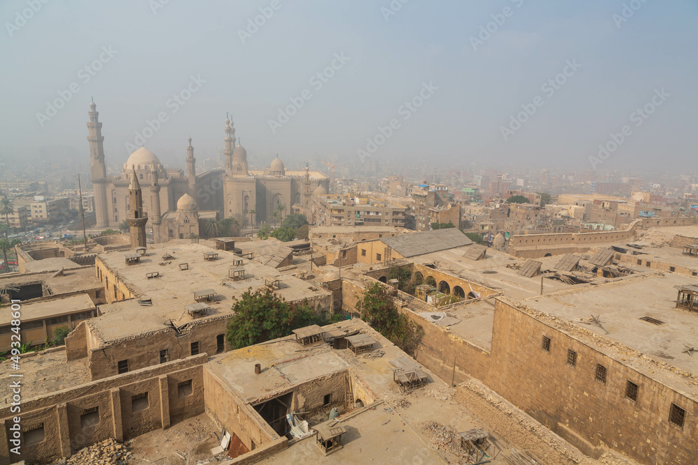 View over Cairo city with Mosque of Sultan Hassan through mist. Cairo, Egypt
