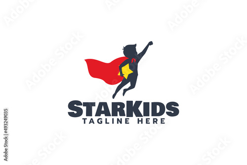a simple logo with a super child jumping while holding a star
