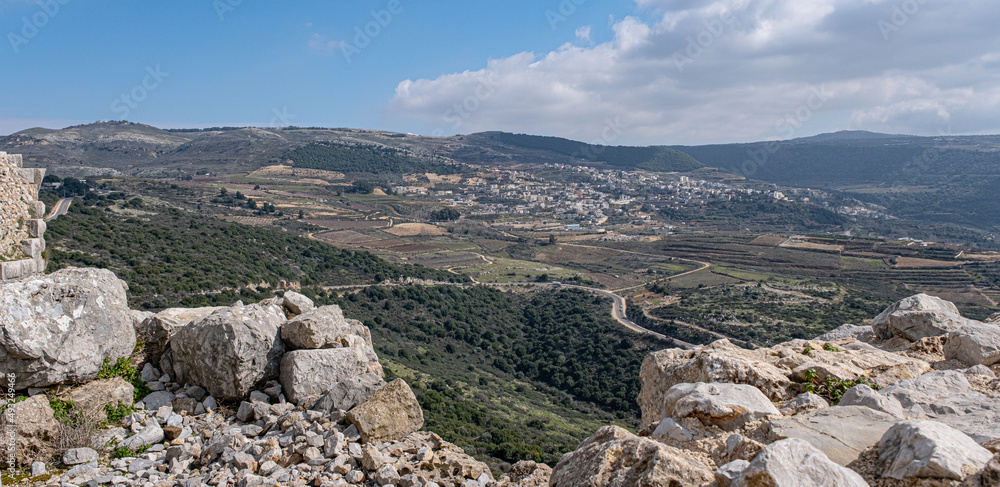 View of Ein-Qiniyye, a Druze village located on the southern foothills of Mount Hermon as seen from Nimrod Crusader Castle southern wall, Golan Heights, Israel.
