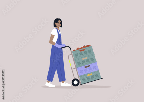 A young character in a denim overall pushing a cargo cart with vegetable and fruit crates stacked  on it