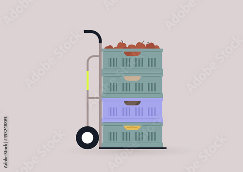 Supermarket plastic crates with fruits and vegetables stacked on a shipping cart