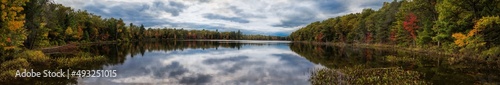 Panorama of early fall morning sunrise on northern Wisconsin Lake. WI