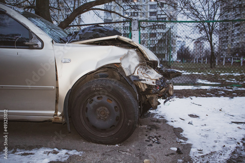 Kyiv, Ukraine, January 8, 2022. Damaged car after road accident. Smashed hood bumper. Auto insurance against an accident on a road. Unfortunate driving result. Vehicle needs repair. Disaster in winter