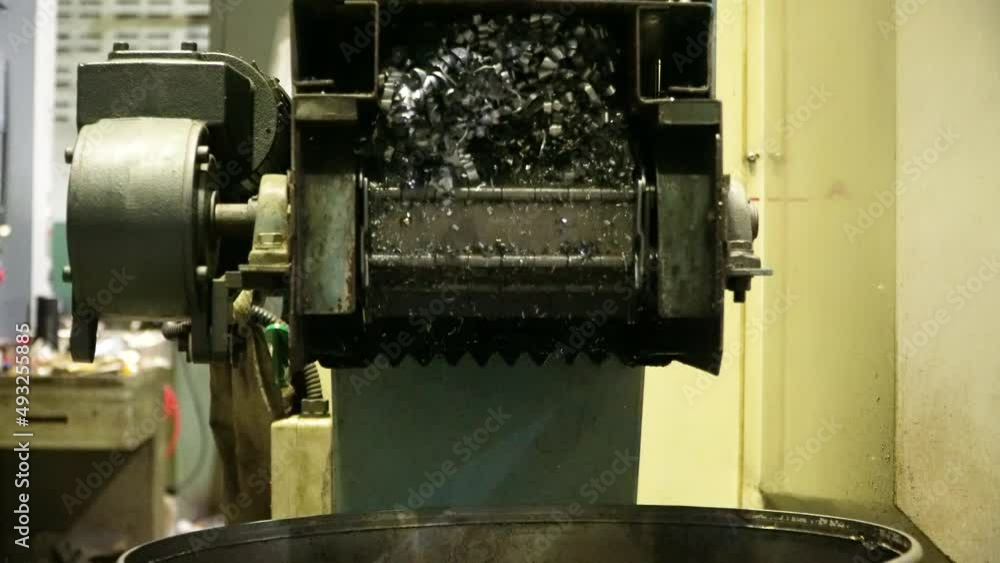 Steel Scrap Moving Scrap Conveyor Lathe Machine,Steel scrap materials recycling. Aluminum chip waste after machining metal parts on a cnc lathe. Closeup twisted spiral steel shavings. Small roughness Steel Scrap Moving Scrap Conveyor Lathe Machine,Steel scrap materials recycling. Aluminum chip waste after machining metal parts on a cnc lathe. Closeup twisted spiral steel shavings. Small roughness