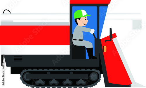 コンバインを運転する男性