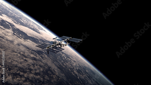 illustration of the International Space Station, ISS, with the planet earth in the background for web articles,posters etc. (ID: 493258037)