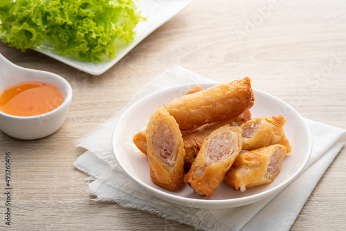 Deep fried spring roll with glass noodles on a white plate.Chinese Traditional