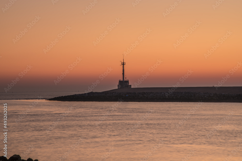 Den Helder, Netherlands. March 2022. The harbor head of Den Helder at sunrise. Den Helder, Netherlands. March 2022. The harbor head of Den Helder at sunrise.