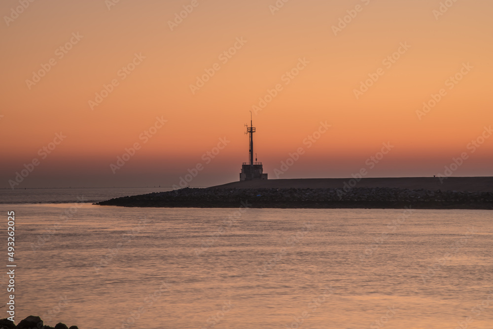 Den Helder, Netherlands. March 2022. The harbor head of Den Helder at sunrise.