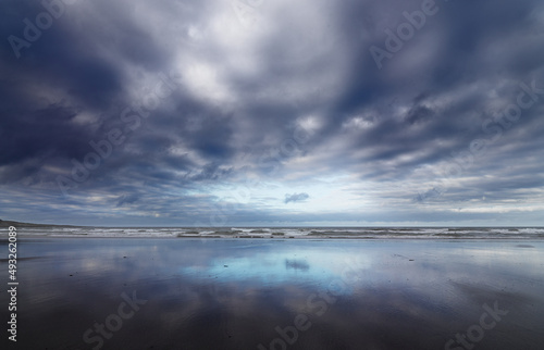 Photos Clouds over a beach at the Varanger peninsula in northern Norway