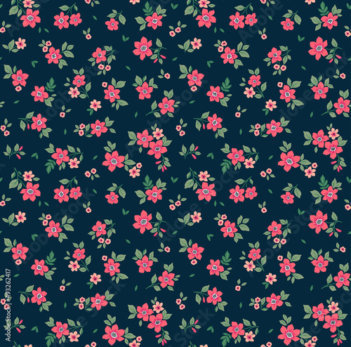 Trendy seamless vector floral pattern. Endless print made of small pink flowers. Summer and spring motifs. Dark blue background. Stock vector illustration.