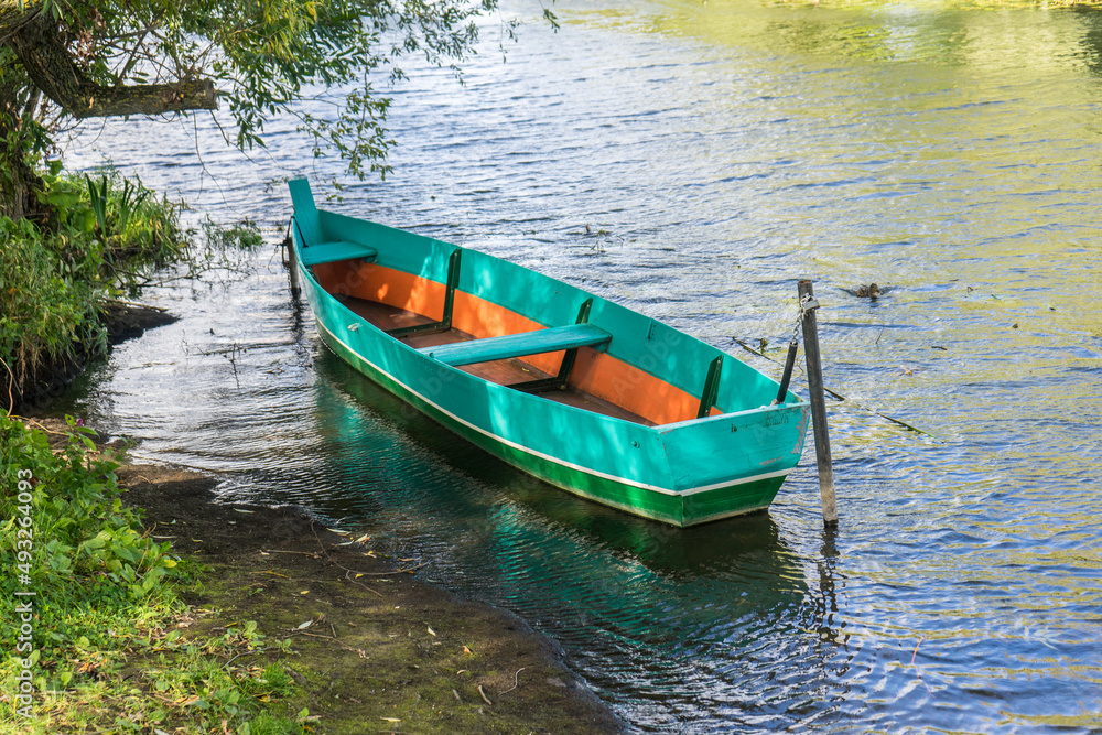 Rowing boat floating over the Lake. Fishing lake in early summer. Rowing boat floating over the Lake. Fishing lake in early summer.