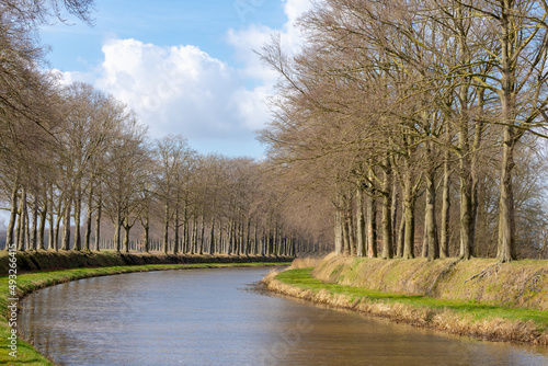 Canal or river in small town village Holten, The Schipbeek is a tributary of the IJssel in Holland and a continuation of the Buurserbeek, It flows into the IJssel near Deventer, Overijssel province. photo