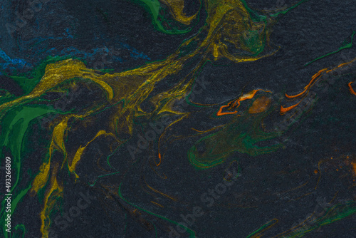 Black orange green fluid art. Abstract acrylic painting background. Modern marble texture. The concept of natural texture, creative wave. Fashion art, mockup for booklets, covers, notebooks, banners