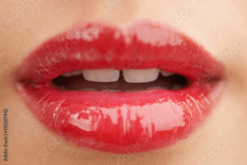 All the better to kiss you with. Cropped shot of a beautiful young woman isolated on white.