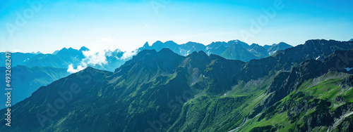 Kleinwalsertal alps mountains landscape panorama background - Mountain panorama in summer with blue sky in Austria