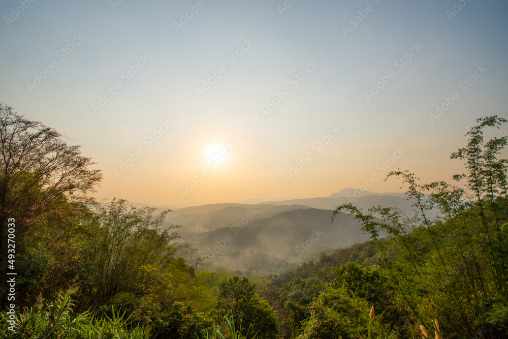 Majestic sunset in landscaped mountains, Chiang Rai, Thailand.