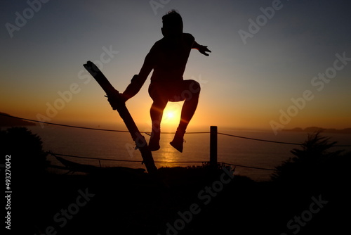 Man person human silhouette sunset jump skate jump log wood