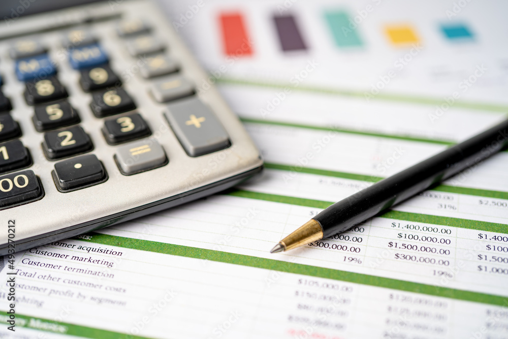 Calculator on chart and graph spreadsheet paper. Finance development, Banking Account, Statistics, Investment Analytic research data economy, Stock exchange trading, Business company concept. Calculator on chart and graph spreadsheet paper. Finance development, Banking Account, Statistics, Investment Analytic research data economy, Stock exchange trading, Business company concept.