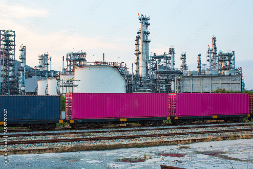 Scene of tank oil refinery plant and tower column of petrochemistry industry container on train rail way Scene of tank oil refinery plant and tower column of petrochemistry industry container on train rail way