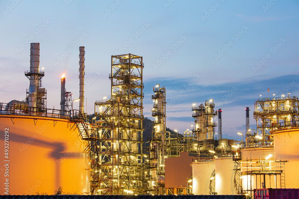 Twilight scene of tank oil refinery plant and tower column of Petrochemistry industry