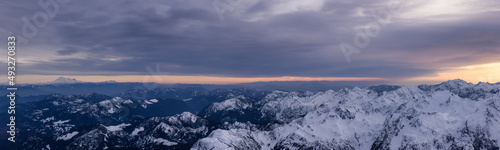 Aerial Panoramic View of Canadian Rocky Mountain Landscape. Cloudy Sunset Sky. Located near Vancouver, British Columbia, Canada. Nature Background Panorama