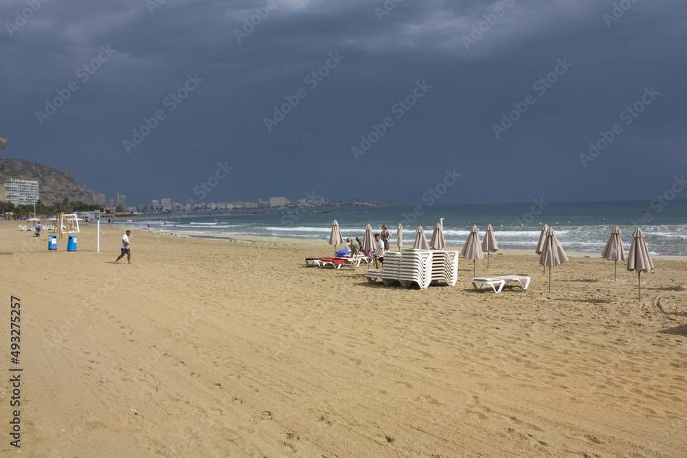 Scenic view of blue sea and beach at rainy day in Alicante, Spain