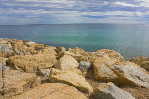 Blue seascape under clouds sky