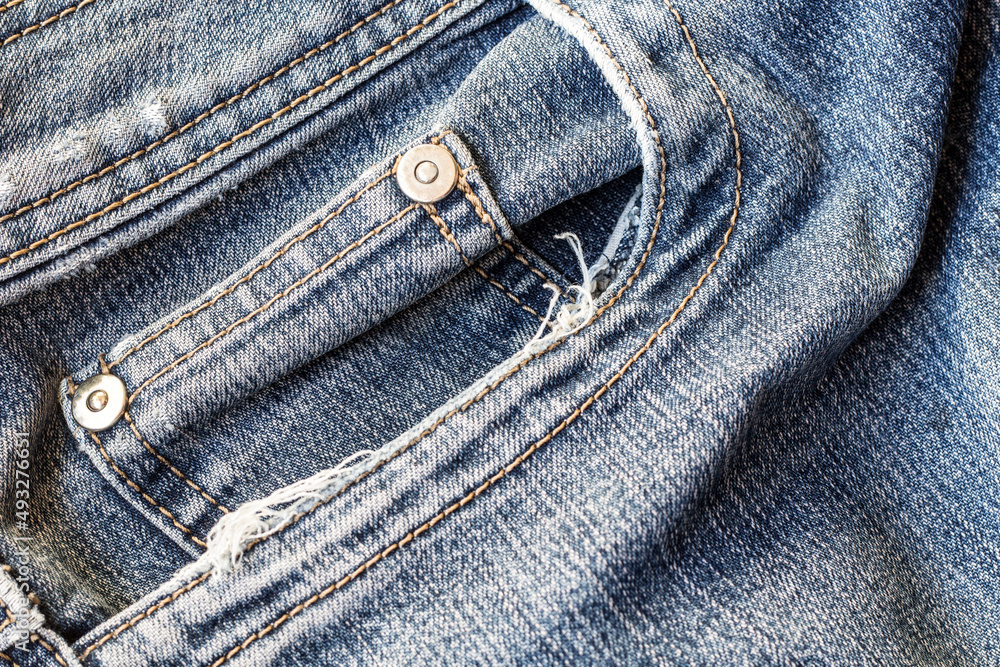 jeans trousers close up of denim material jeans trousers close up of denim material