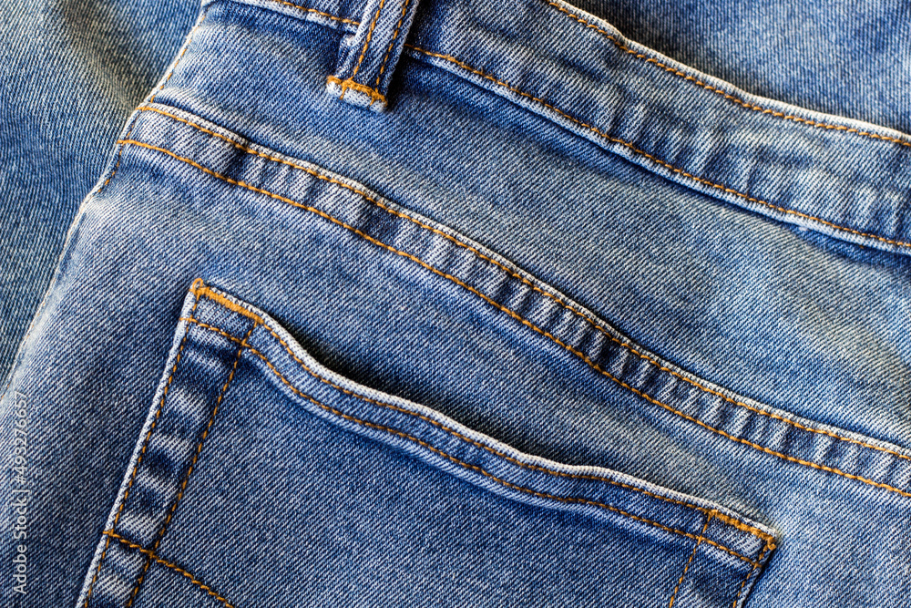 jeans trousers close up of denim material jeans trousers close up of denim material