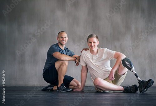 Portrait of positive recovery. Portrait of a male amputee and his physiotherapist.