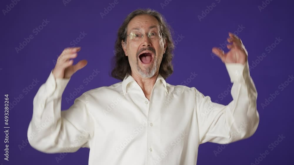 Thinking mature man 50s 60s looks around thinks comes up with great idea raised finger isolated plain solid purple background studio portrait Thinking mature man 50s 60s looks around thinks comes up with great idea raised finger isolated plain solid purple background studio portrait