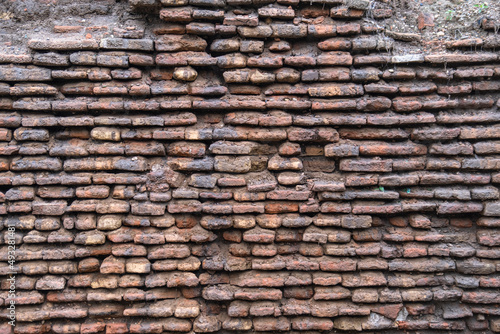 demolished brick wall of old historical building