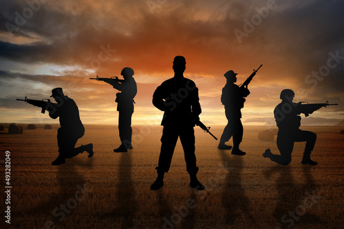 Silhouettes of soldiers in ...