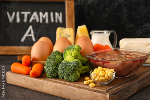 Fototapeta Naklejka Na Ścianę i Meble -  Set of healthy products rich in vitamin A on dark background