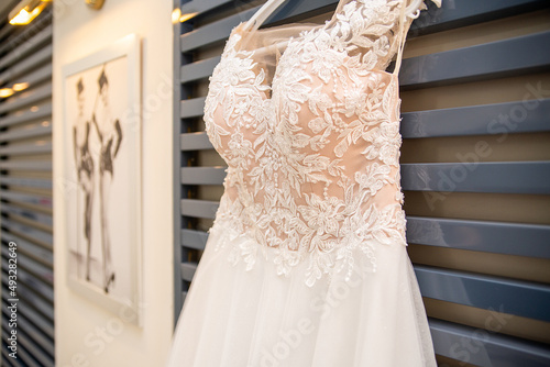 bride's wedding dress on a hanger