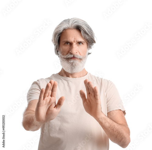 Mature man working with ene...