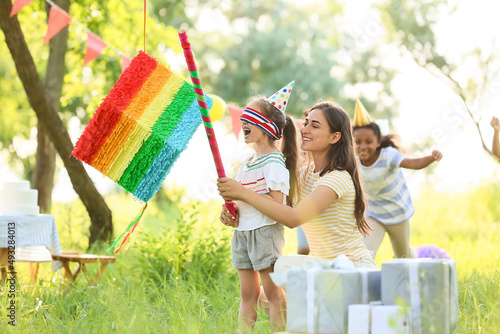 Woman and cute children at ...