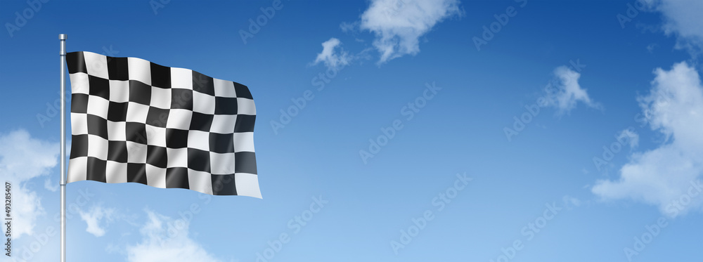 Auto racing finish checkered flag isolated on a blue sky