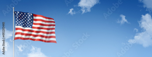 United States flag isolated on a blue sky. Horizontal banner