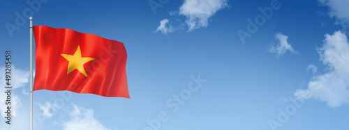 Canvas Print Vietnamese flag isolated on a blue sky. Horizontal banner