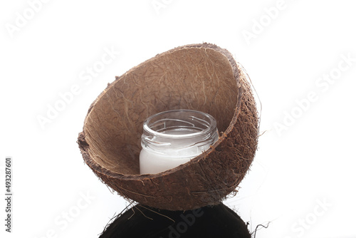 coconut oil with a glass jar is on the table