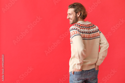 Handsome young man in knitt...