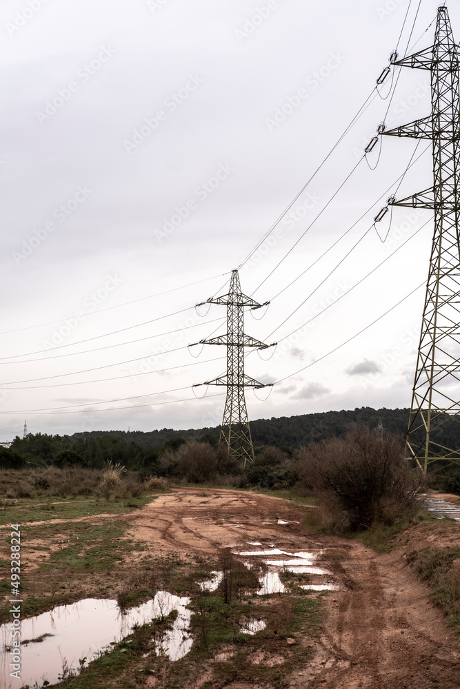 high voltage cable towers in an industrial area in Catalonia