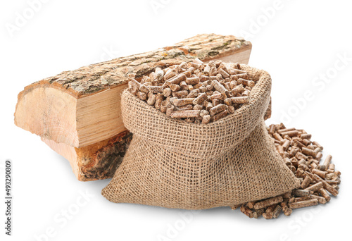Bag with pellets and firewood on white background photo