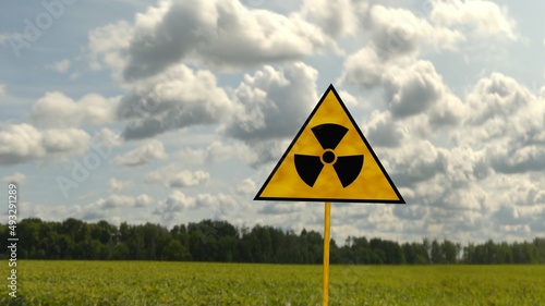Radiation sign on a against the sky and greenery. 3D render photo